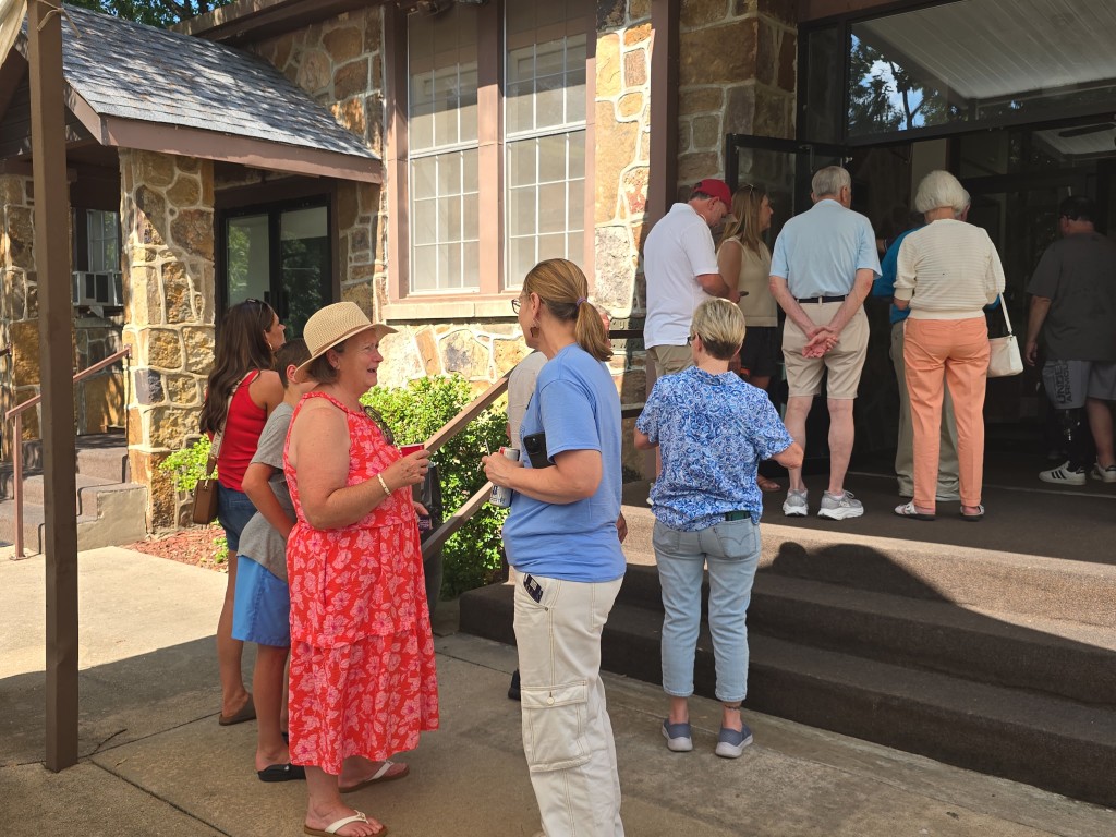 Kelly Grappe for Arkansas Secretary of State — stands with neighbors at an outdoor gathering Kelly Grappe, candidate for Arkansas Secretary of State, stands with neighbors at an outdoor gathering.