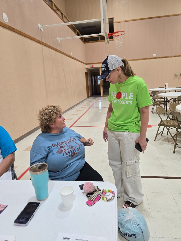 Kelly Grappe for Arkansas Secretary of State — listens to a community member at a hall gathering Kelly Grappe, candidate for Arkansas Secretary of State, listens to a community member at a hall gathering.