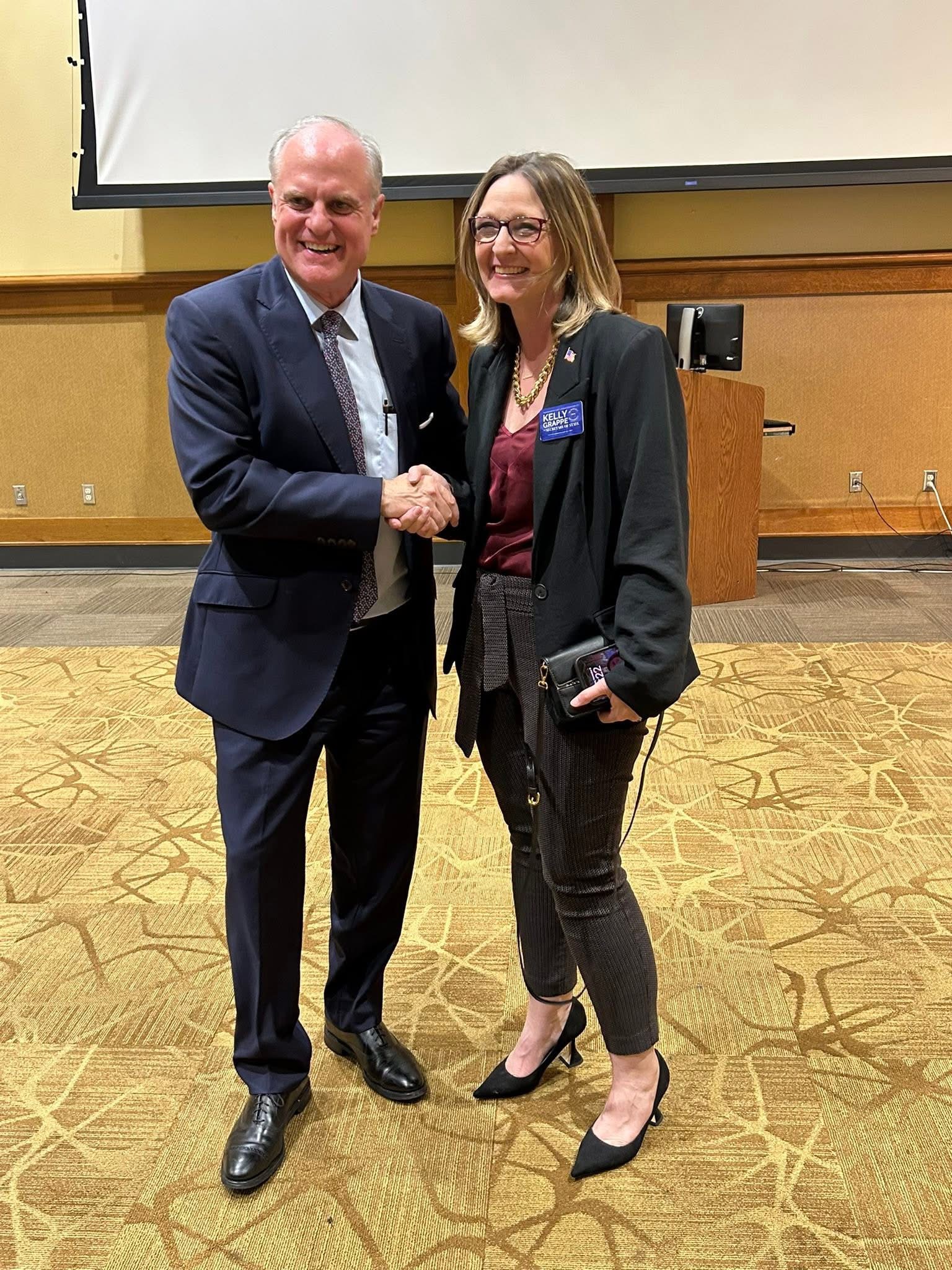 Kelly Grappe for Arkansas Secretary of State — campaign photo Kelly Grappe, candidate for Arkansas Secretary of State. Kelly Grappe greets an Arkansas neighbor with a handshake at a county event.